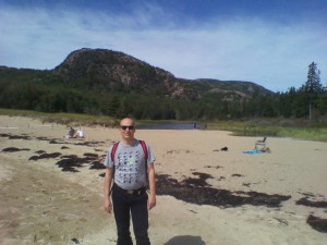 A tourist on Sandy Beach, Mt. Desert Island